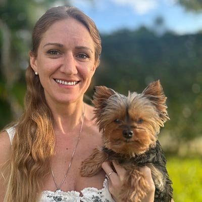 Dog sitter in Fort Lauderdale is holding a cute dog